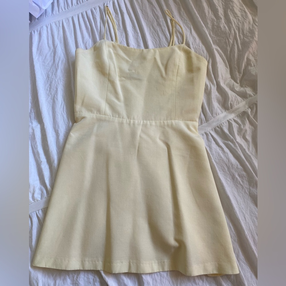 Cute mini dress with built in shorts and adjustable spaghetti straps!